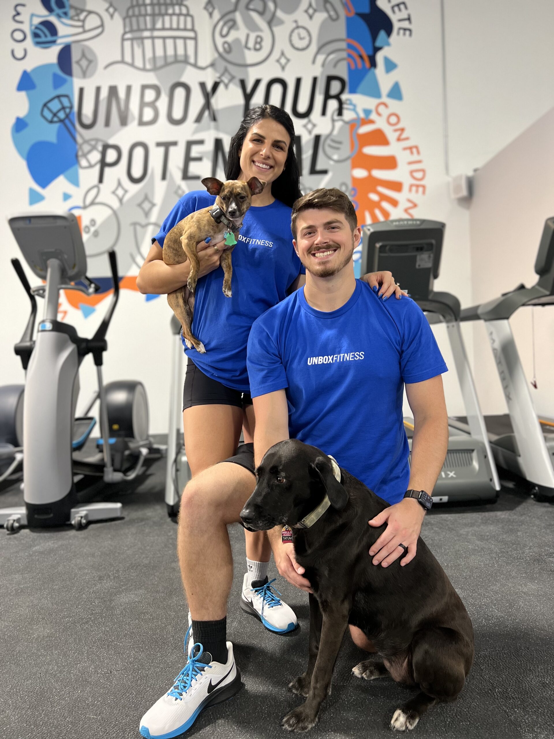 Owners of Unbox Fitness, Halle and Troy Bailey posed in their gym.